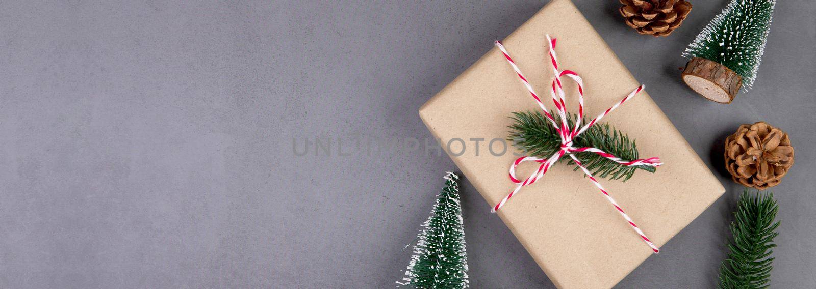 Christmas holiday composition with gift box decoration, new year and xmas or anniversary with presents on cement floor background in season, top view or flat lay, copy space, banner website.
