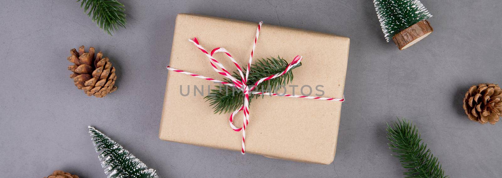 Christmas holiday composition with gift box decoration, new year and xmas or anniversary with presents on cement floor background in season, top view or flat lay, copy space, banner website.