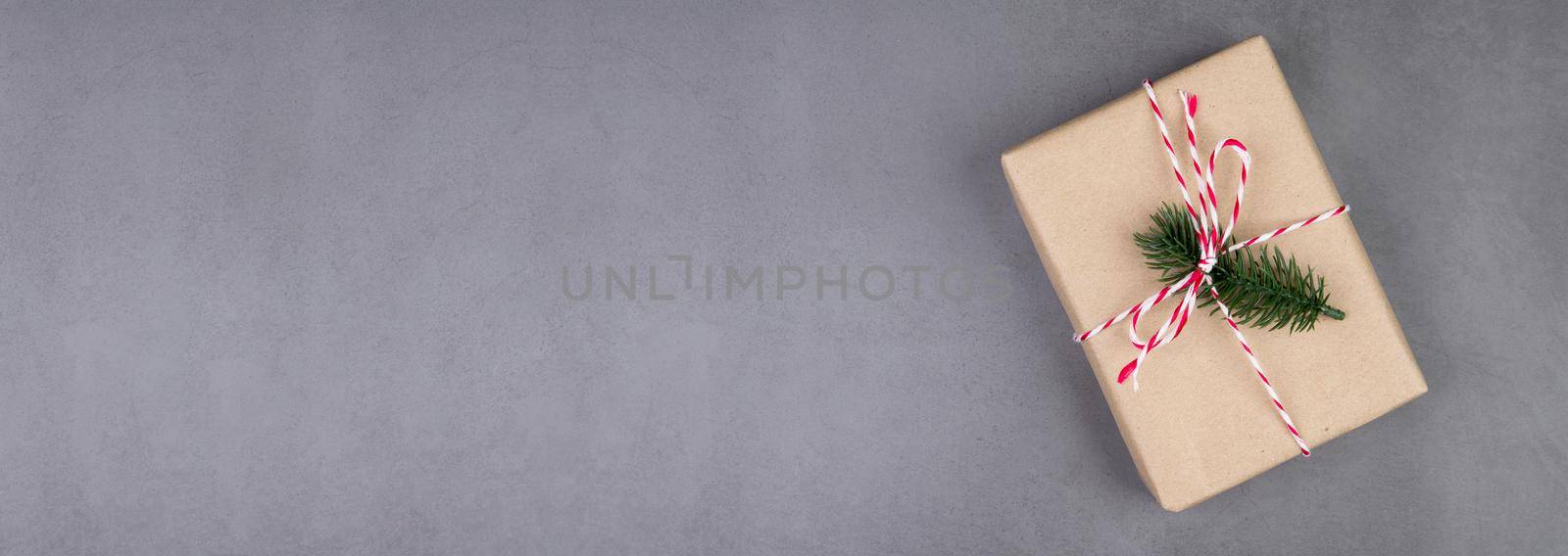 Kraft gift box on cement floor background in Christmas day or holiday, present box on desk, celebration with copy space, celebrate and festive, top view, flat lay, nobody, banner website.