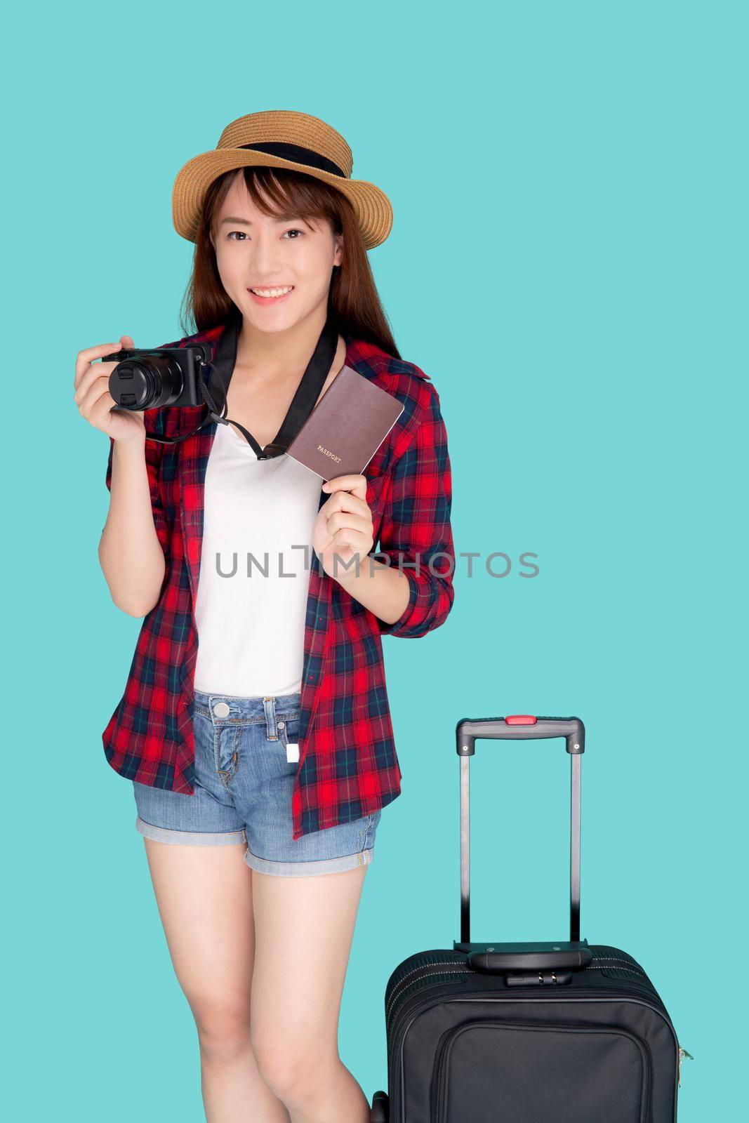 Beautiful portrait young asian woman with luggage smiling and travel summer trip for abroad in vacation, happy asia girl holding camera and passport with suitcase for journey with cheerful in holiday.