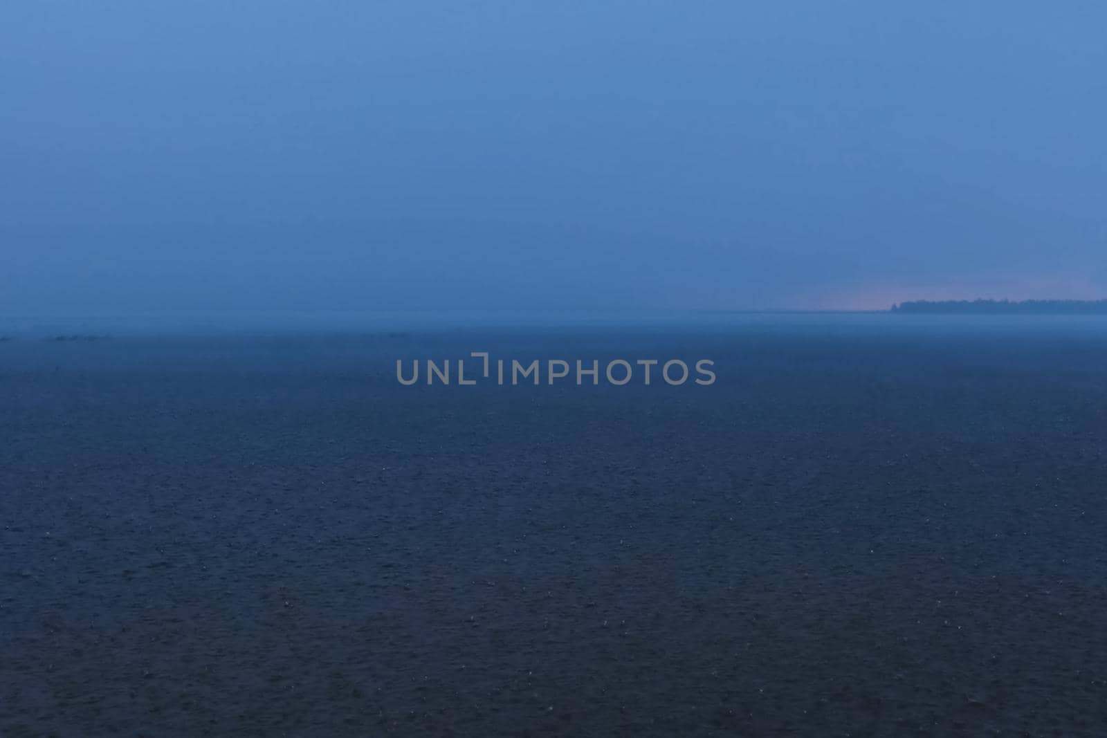 A downpour over the water surface of the overlook. The gurgles of water. Water splashes and drops.