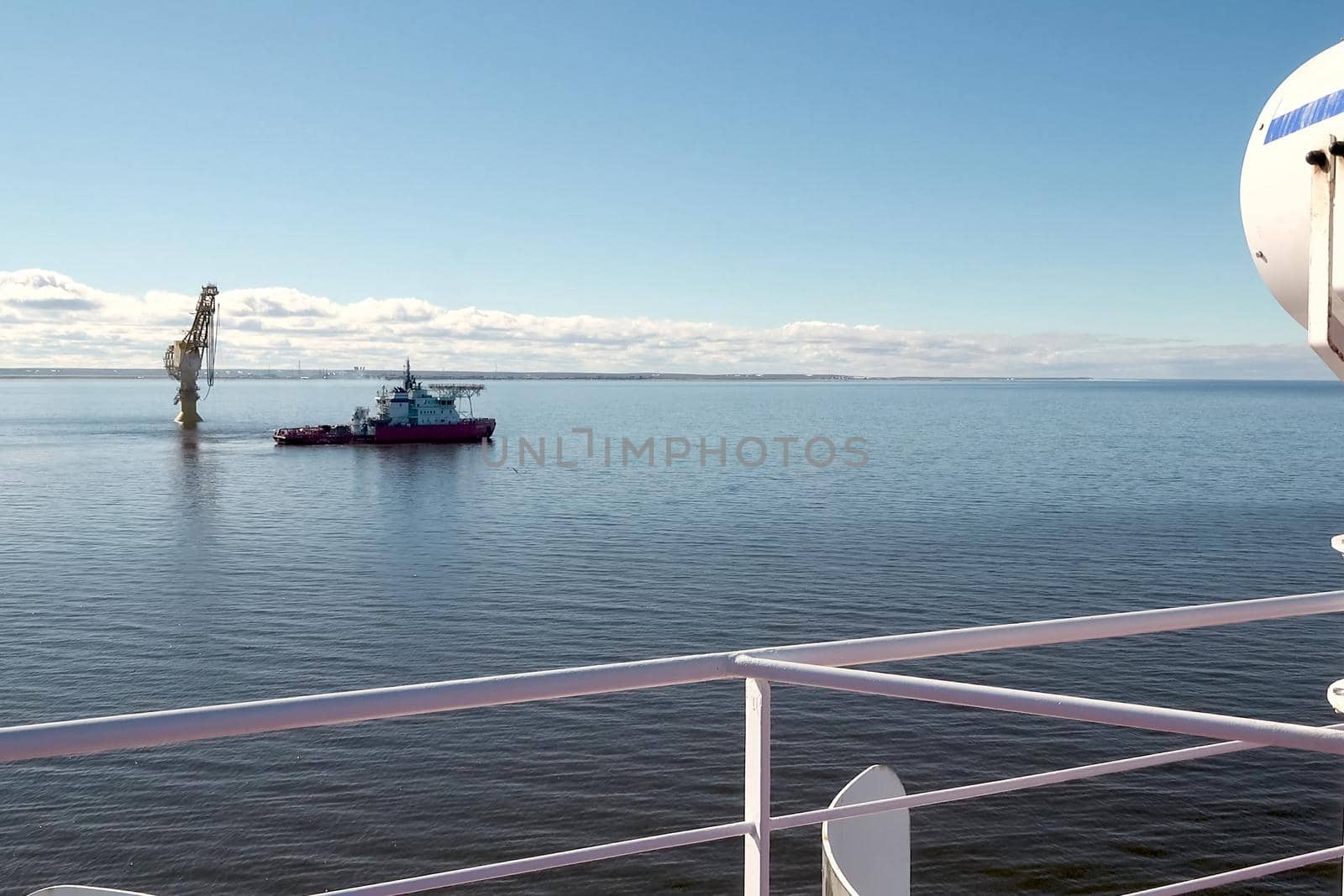 Arctic navigation in the summer. Service ships at sea.