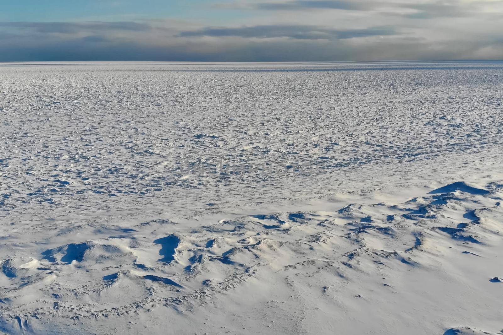 shore of the arctic ocean. Snow and ice on the shore. by DePo