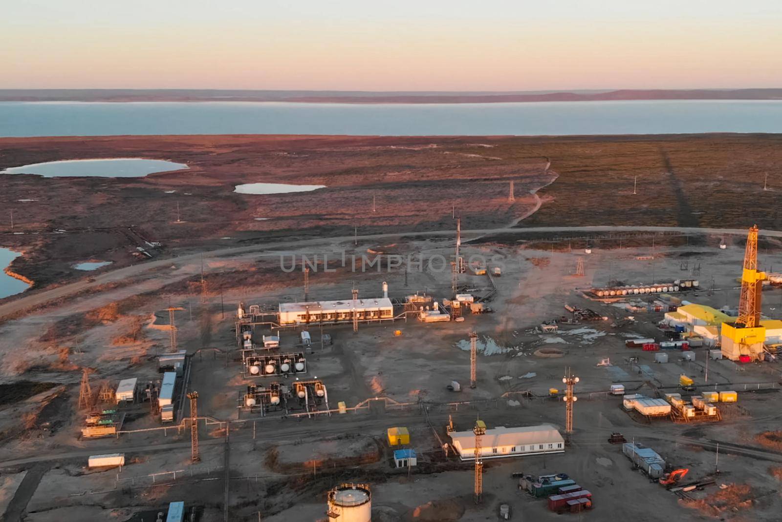 An oil field by the sea. service buildings and equipment.