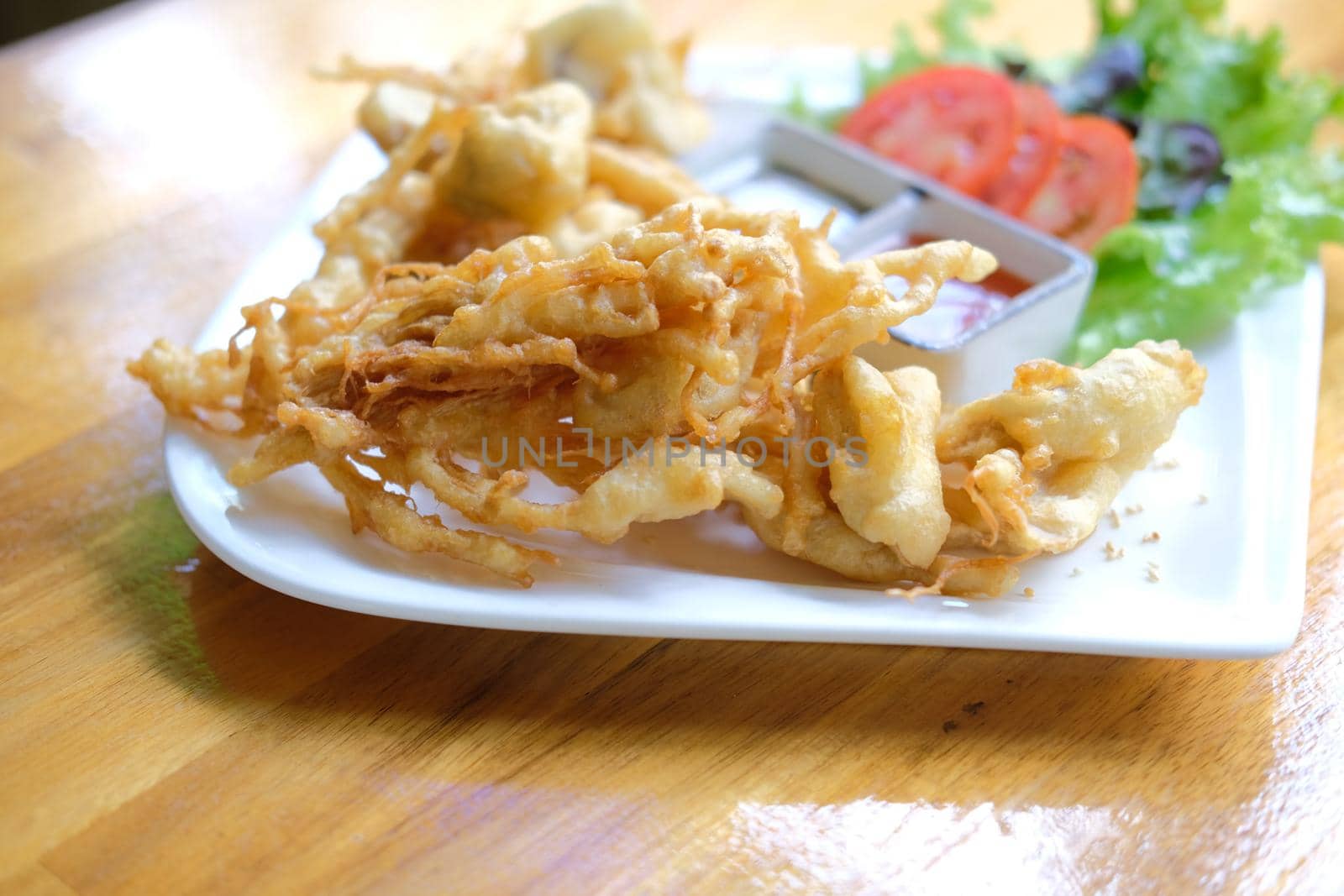 deep fried mushroom with dipping sauce and vegetable. vegetarian vegan appetizer