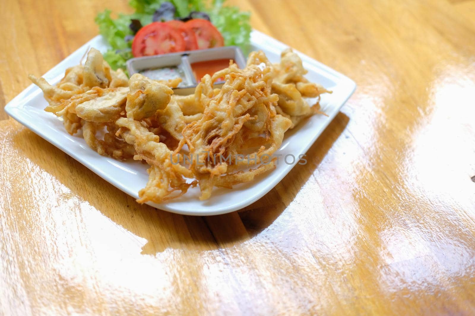 deep fried mushroom with dipping sauce and vegetable. vegetarian vegan appetizer