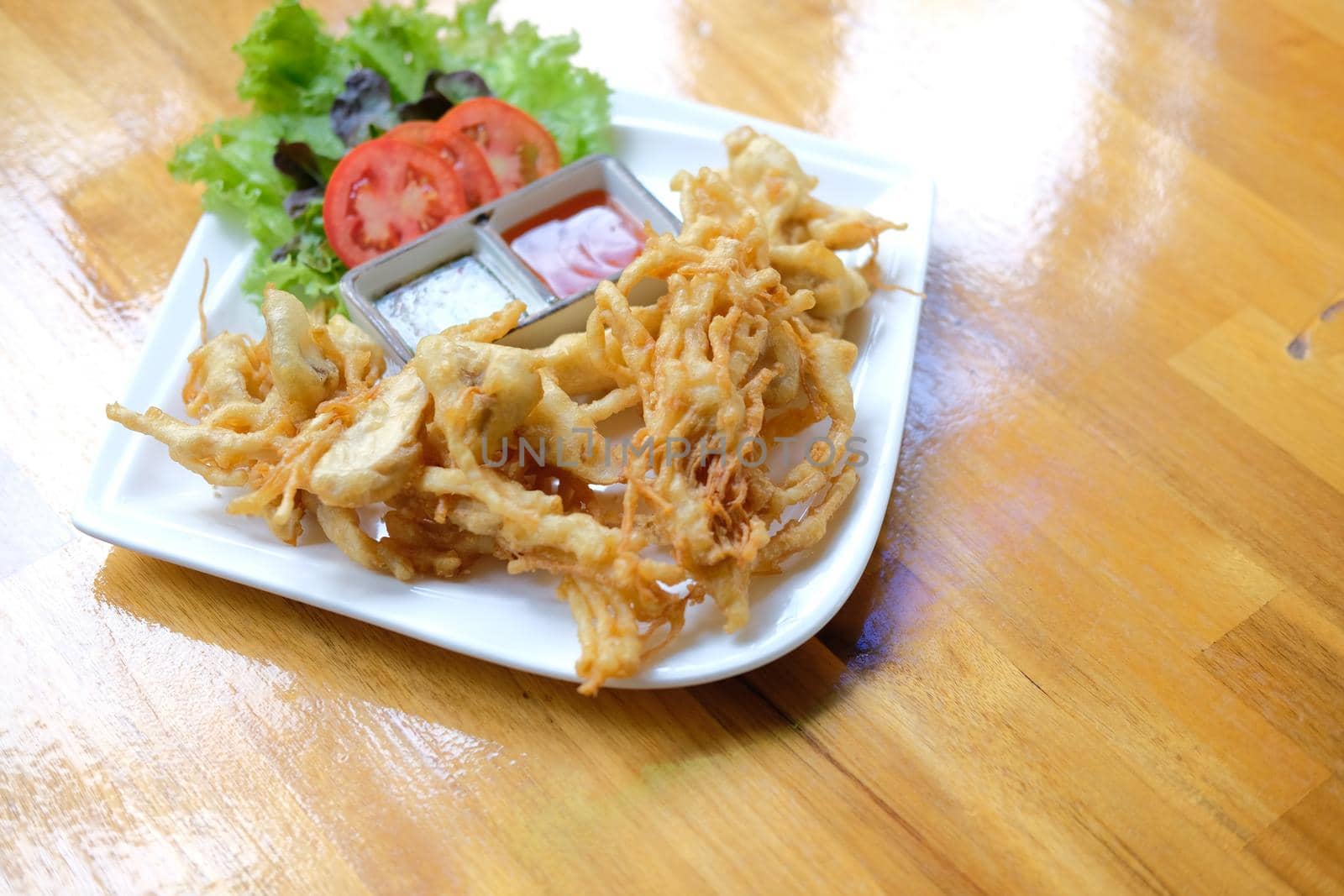 deep fried mushroom with dipping sauce and vegetable. vegetarian vegan appetizer