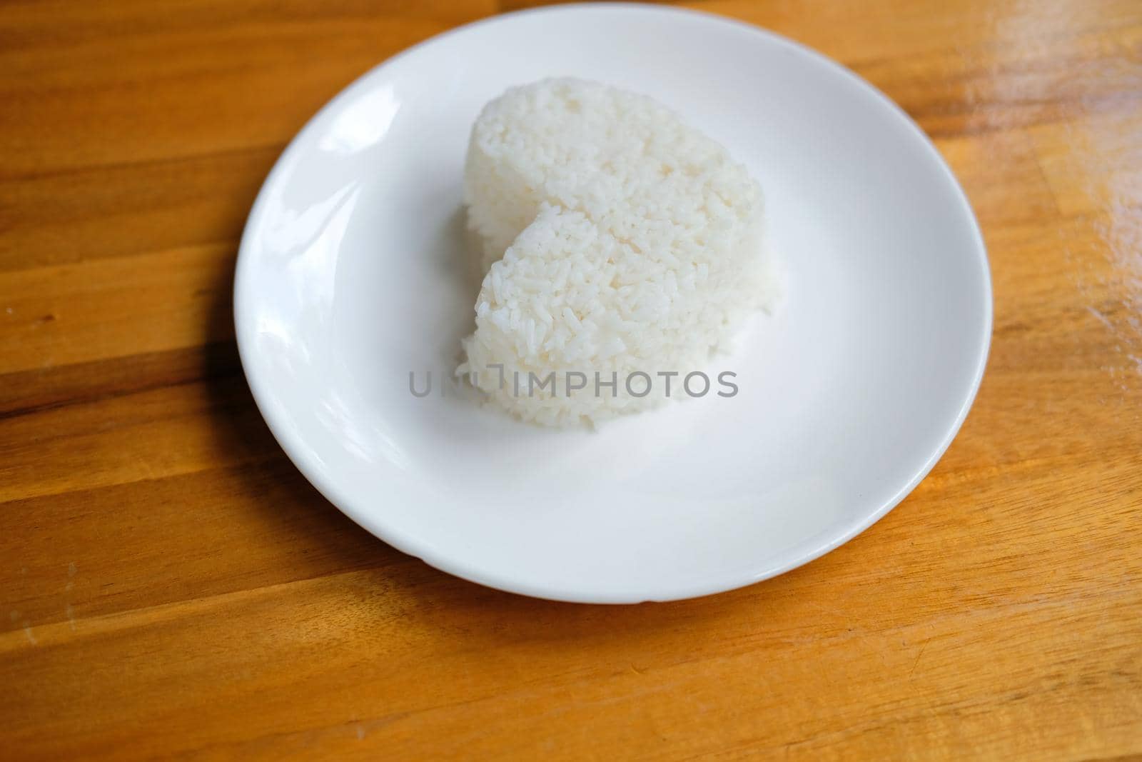 heart shaped steamed rice in white plate serving in restaurant