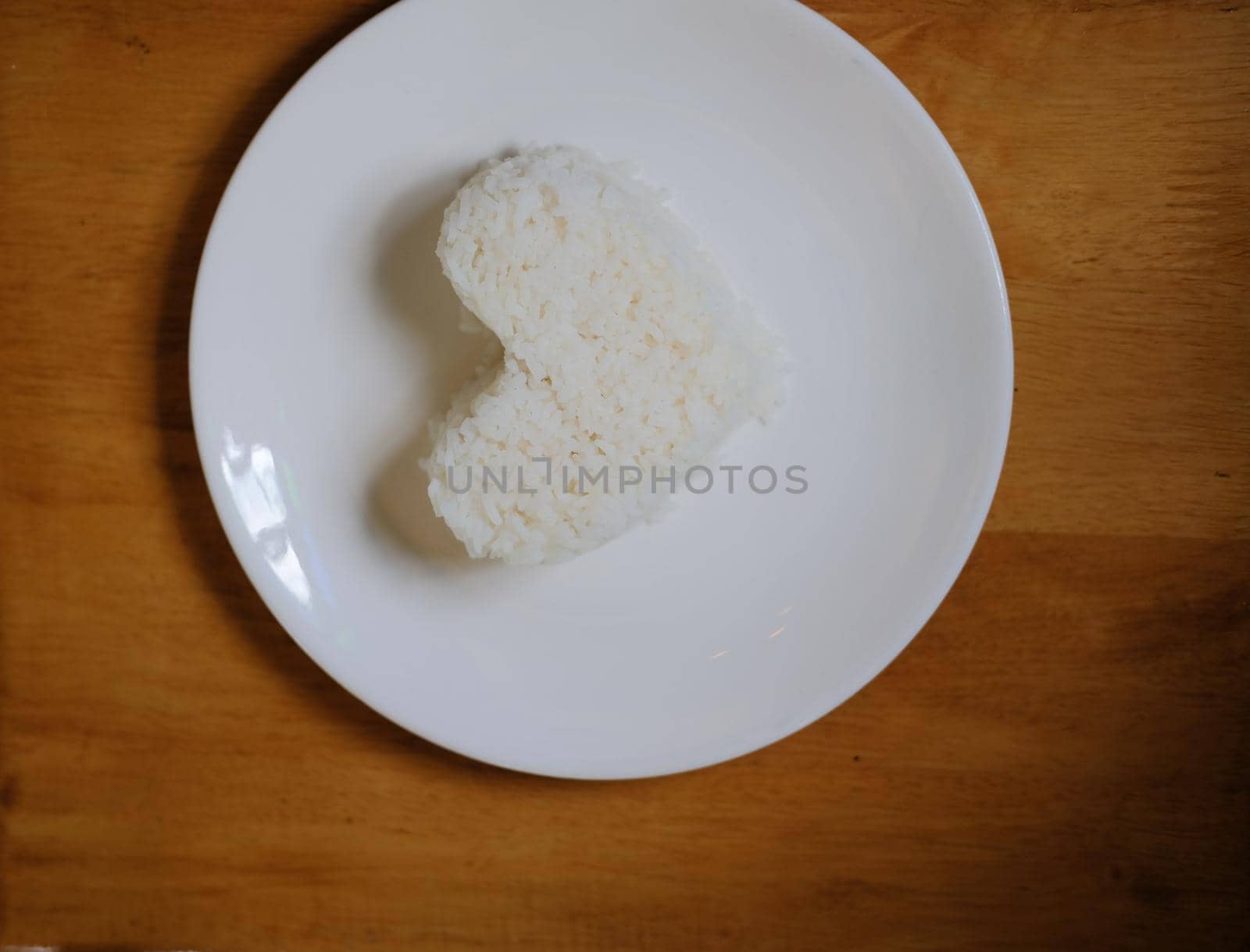 heart shaped steamed rice in white plate serving in restaurant