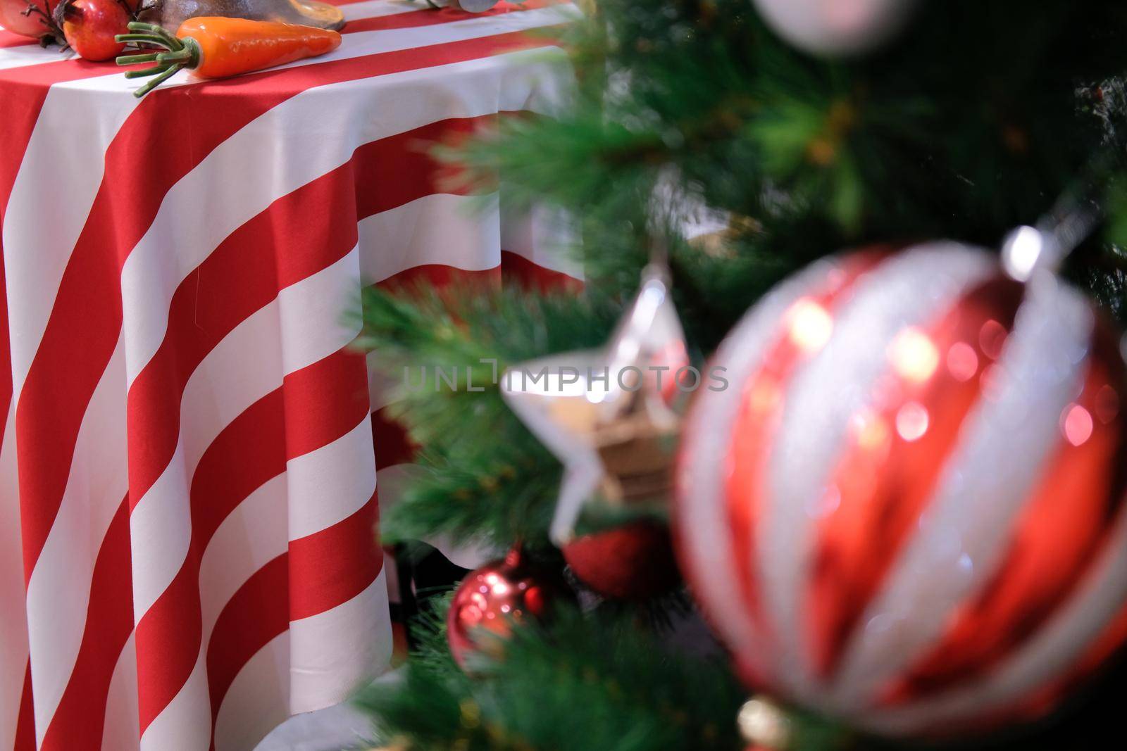 red white striped fabric tablecloth with festive christmas ornament decoration. xmas festival