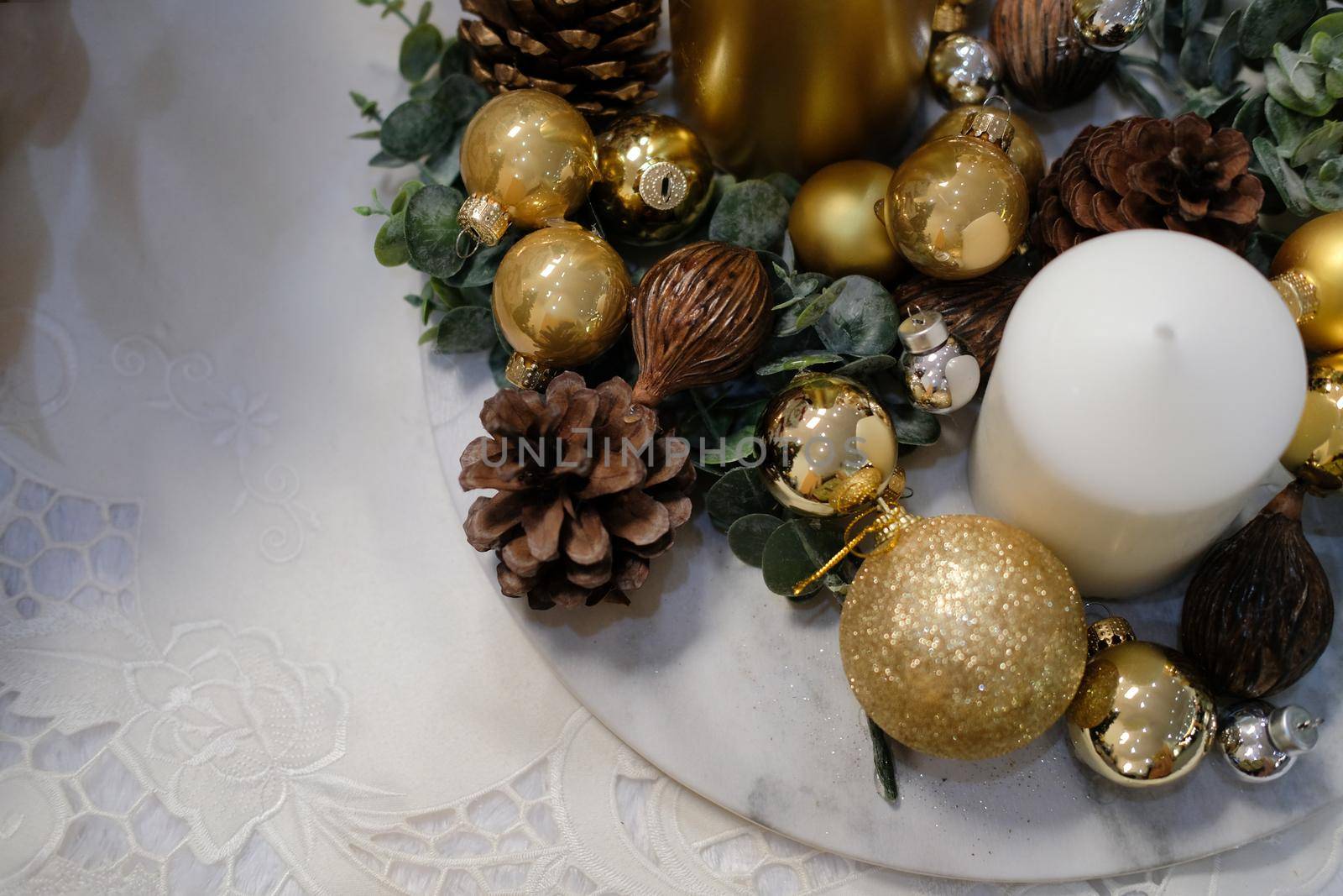 golden christmas balls. festive ornament decoration. candle, conifer cone