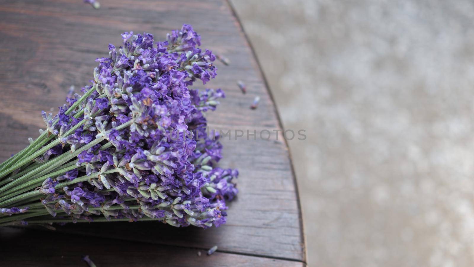 Bunch or bouquet of purple lavender flowers on a wood texture table. Group of lavandula from Furano province Hokkaido Sapporo Japan. Photo from above., aroma herbs concept