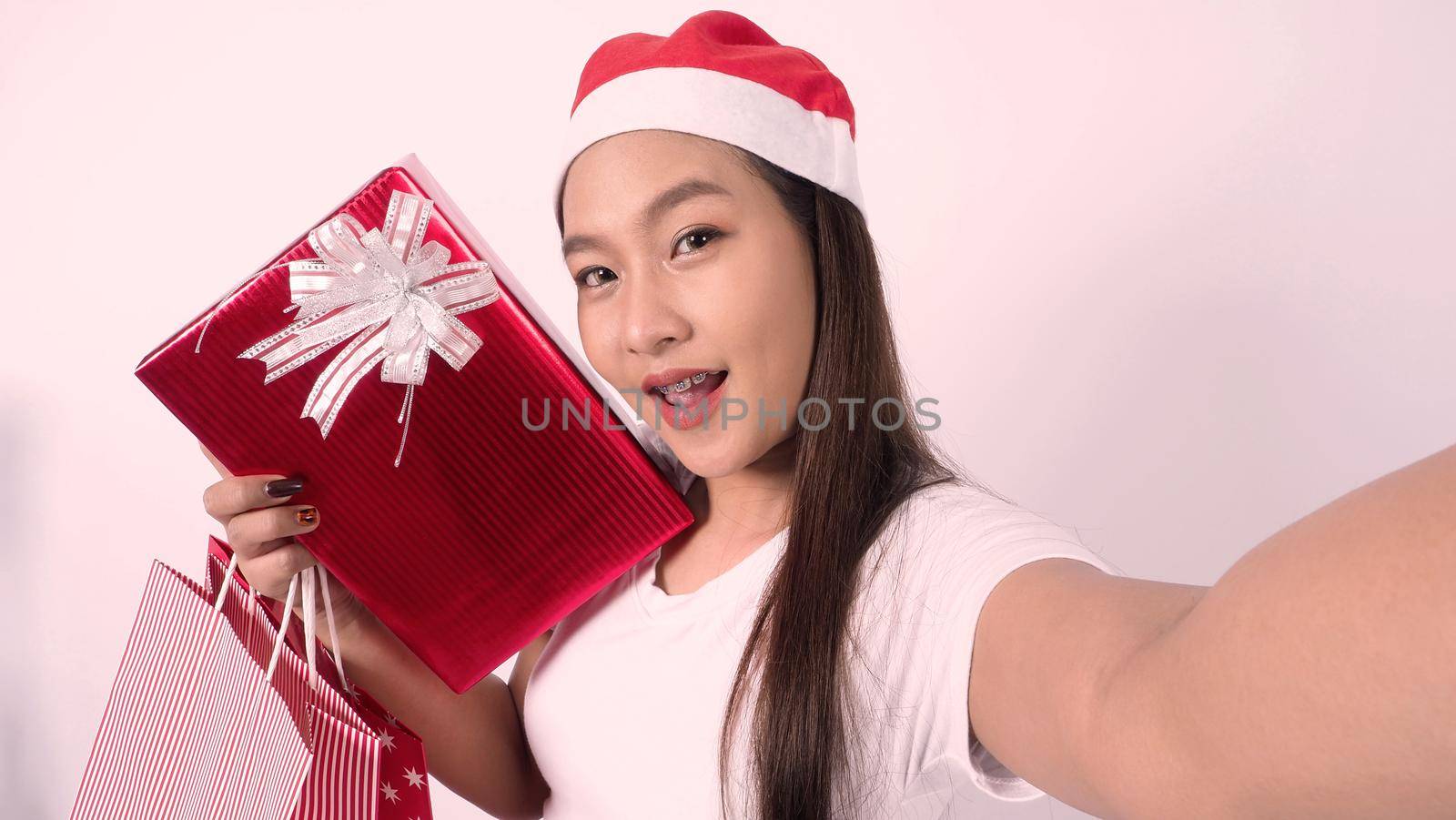 Christmas online holiday celebration with teenage asian woman. Party X mas and new year in lockdown coronavirus quarantine covid 19 new normal, social distance, remote communication, stay home vocation, Christmas party online