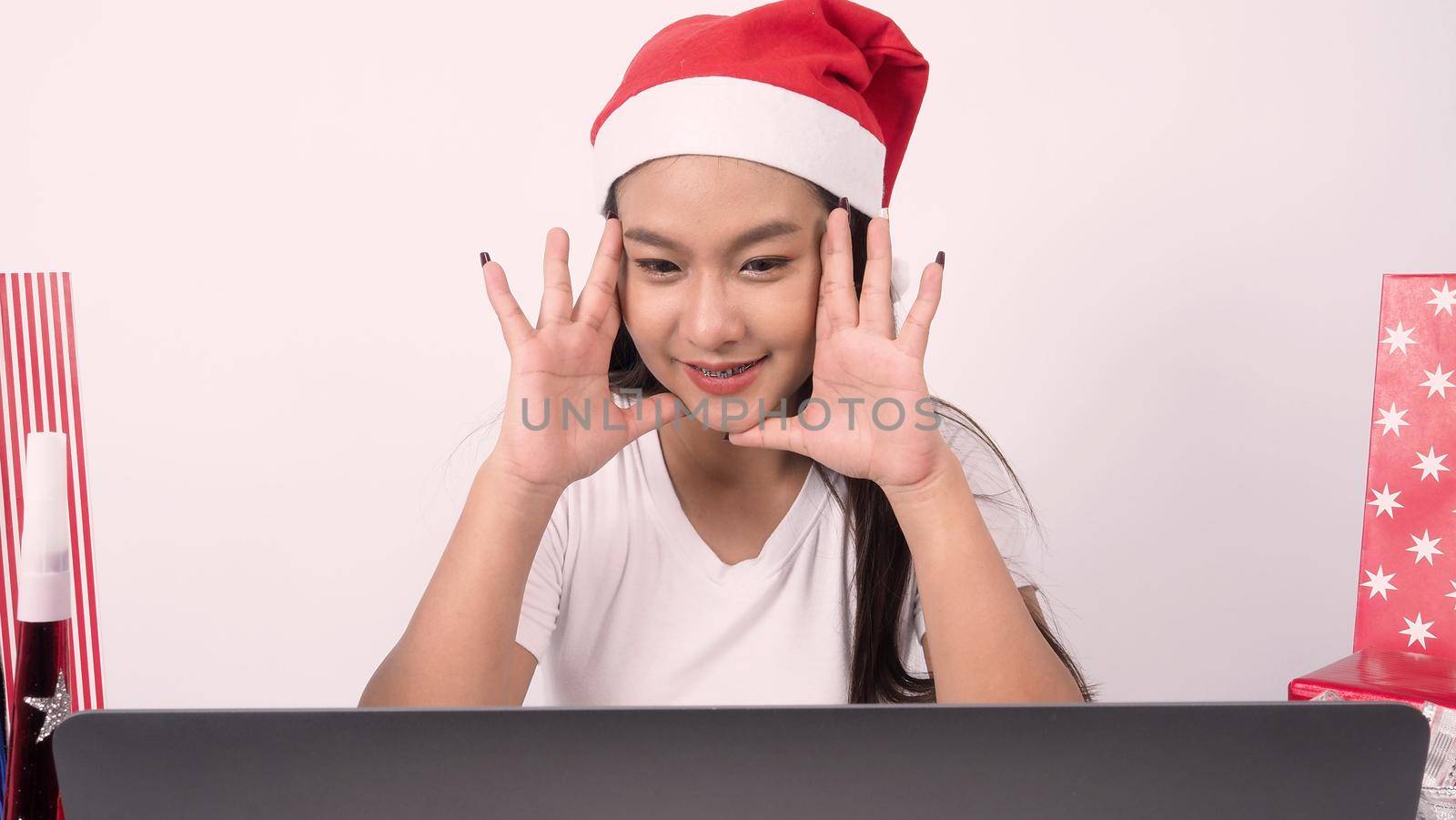 Christmas online holiday celebration with teenage asian woman. Party X mas and new year in lockdown coronavirus quarantine covid 19 new normal, social distance, remote communication, stay home vocation, Christmas party online