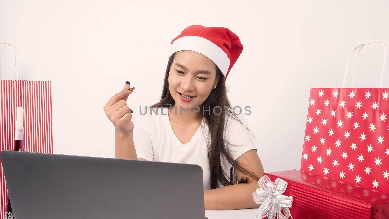 Christmas online holiday celebration with teenage asian woman. Party X mas and new year in lockdown coronavirus quarantine covid 19 new normal, social distance, remote communication, stay home vocation, Christmas party online