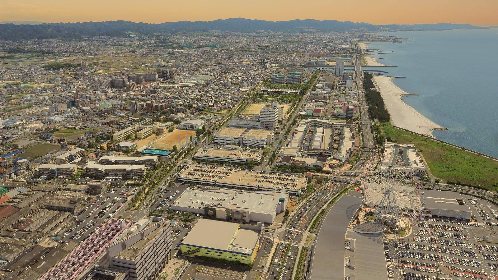 Aerial view or bird eyes view images of Kansai bay area Osaka Japan include big premium outlets located across from Kansai International Airport and it's largest airport in western Osaka bay Kansai Japan. 