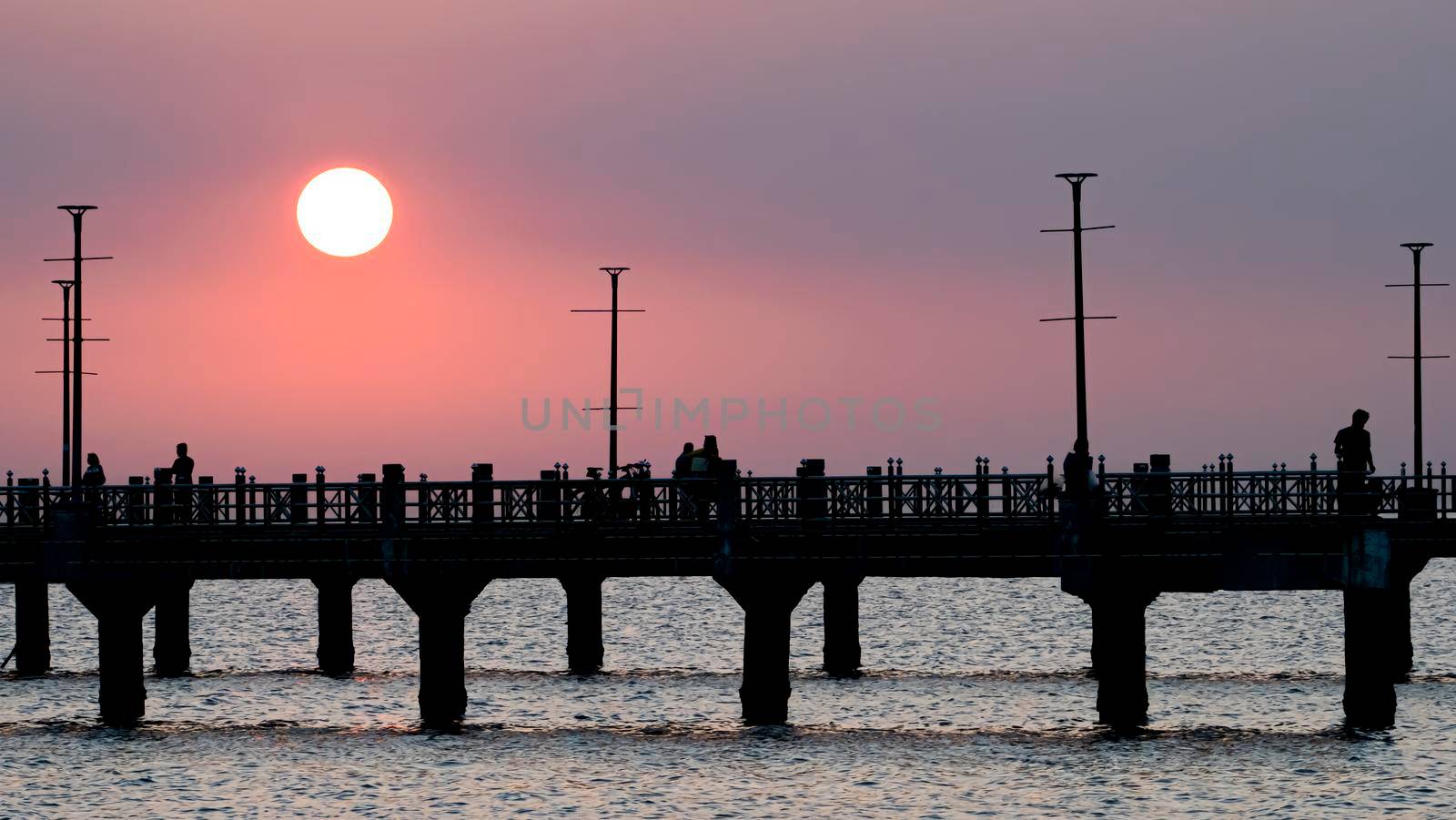 Bangsan Chonburi Thailand jetty and sunset. At Bangsan beach by gnepphoto