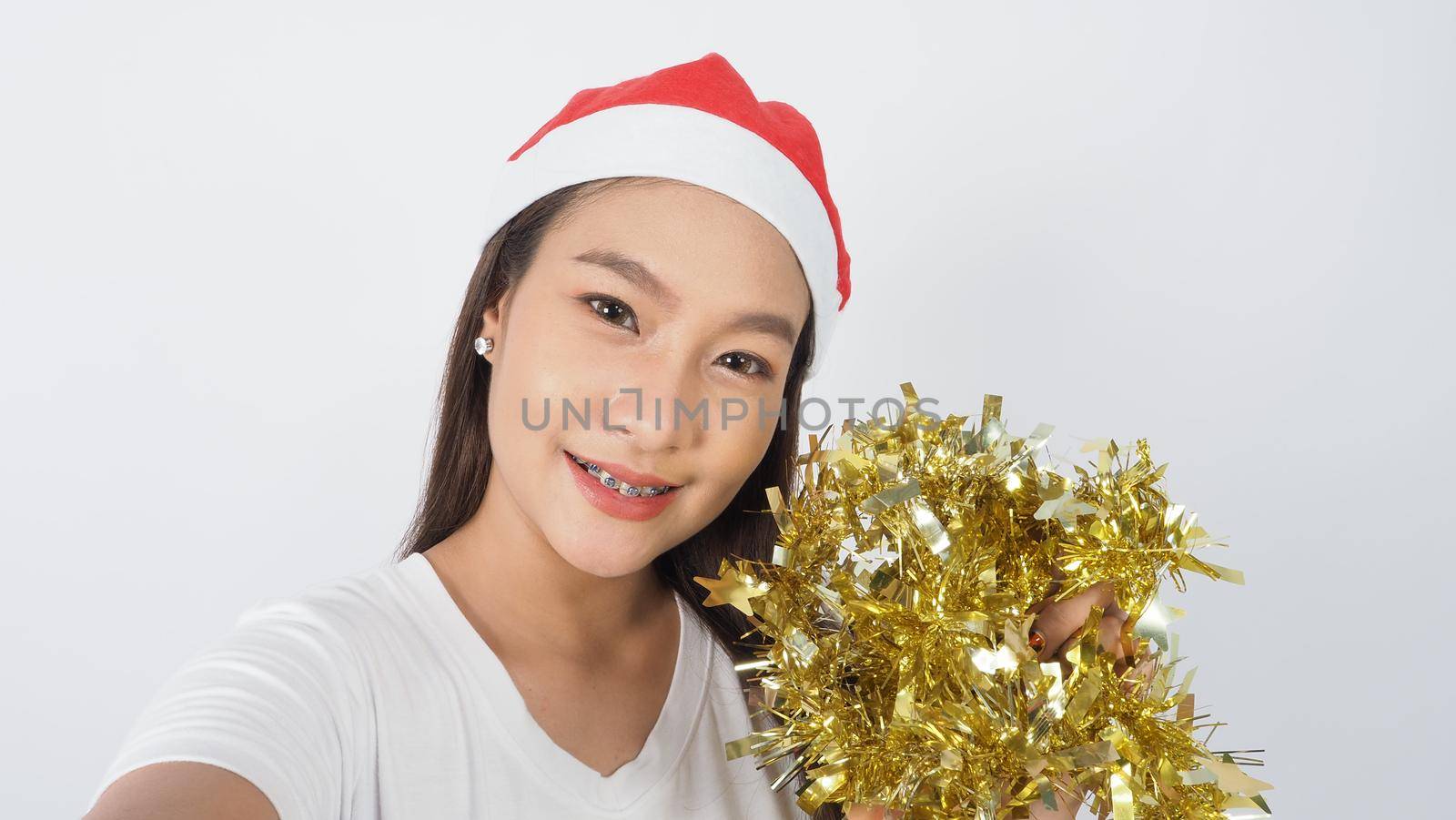 Girl hold gift box make selfie or video online with x-mas christmas prop accessories by gnepphoto