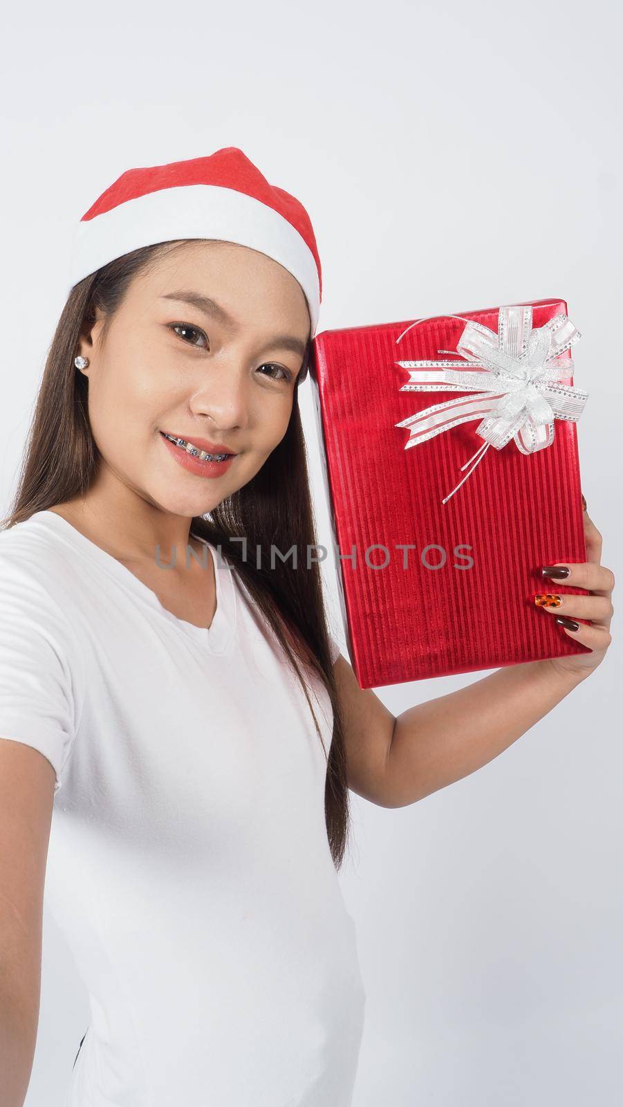 Girl hold gift box make selfie or video online with x-mas christmas prop accessories by gnepphoto
