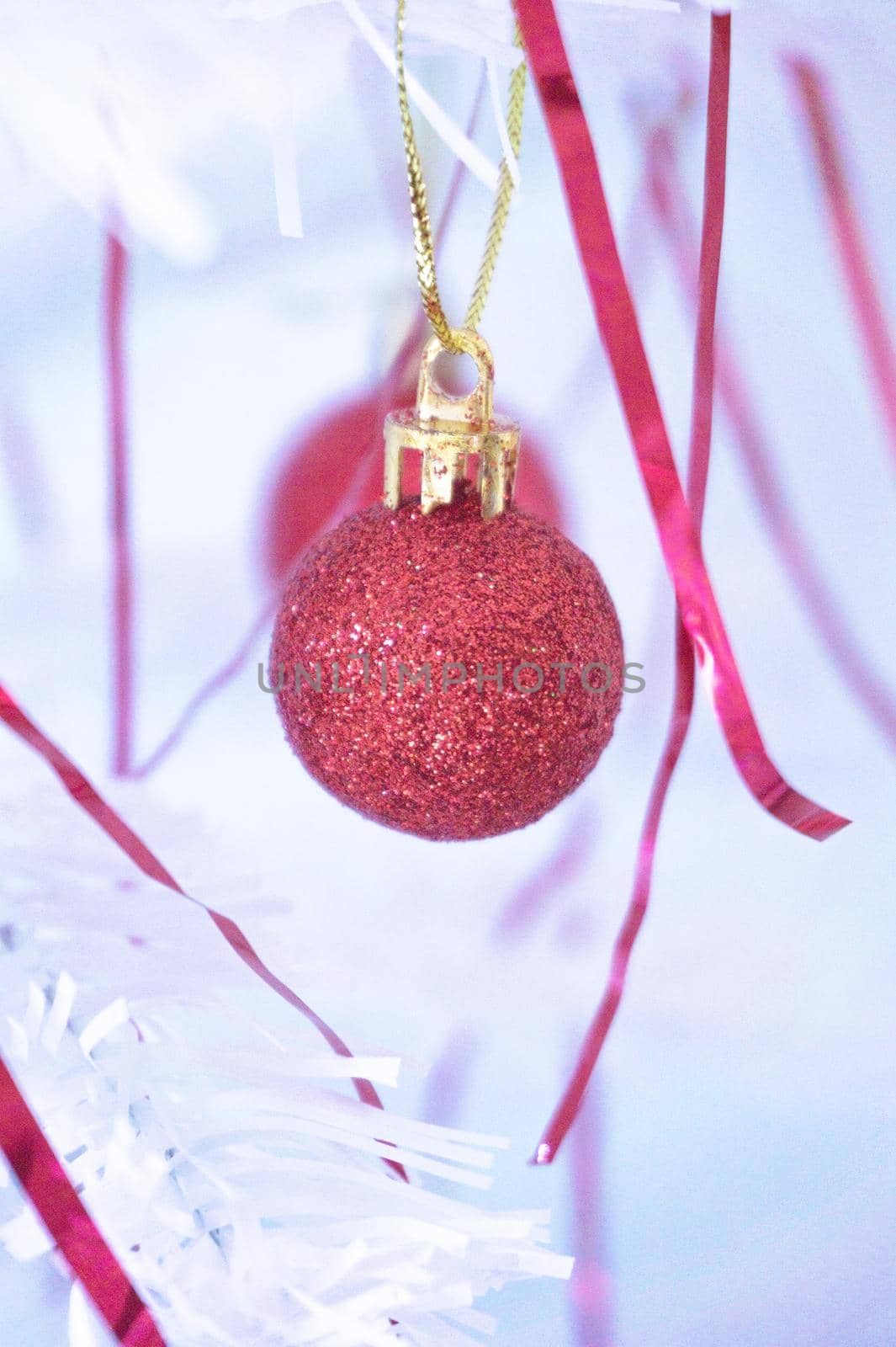 White christmas tree with red decorations. No people