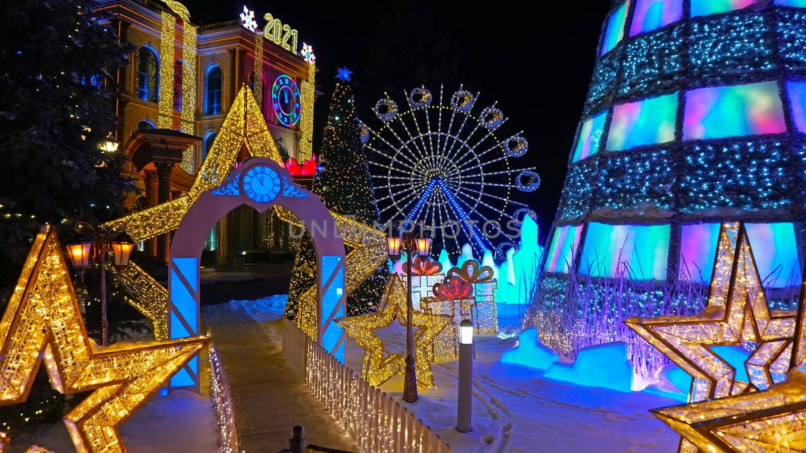 The city is decorated for Christmas and new year. Buildings, garlands, Christmas trees, fences and the square glow with different lights. People relax, enjoy the winter and holiday. Almaty, Kazakhstan