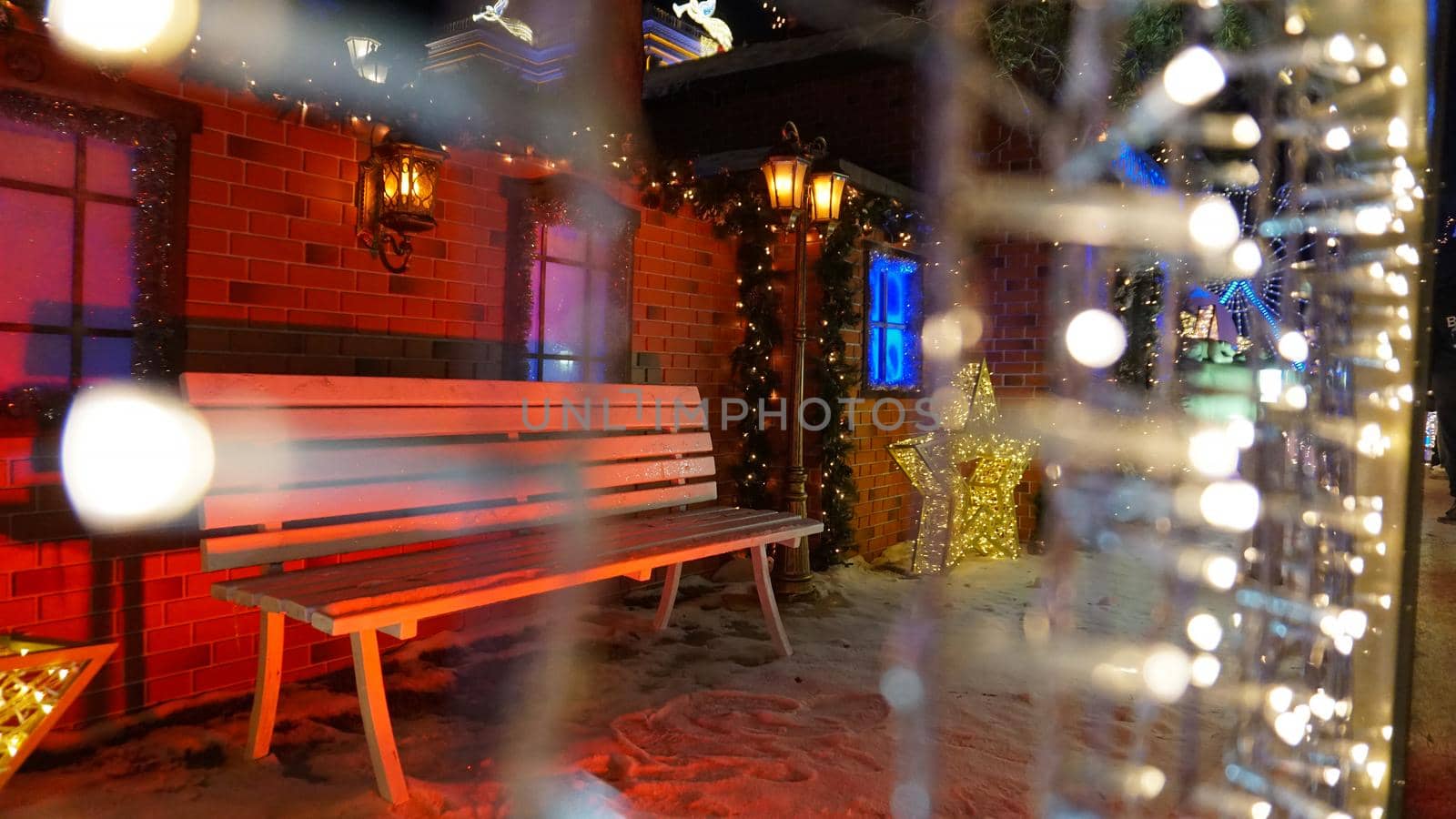 The city is decorated for Christmas and new year. Buildings, garlands, Christmas trees, fences and the square glow with different lights. People relax, enjoy the winter and holiday. Almaty, Kazakhstan