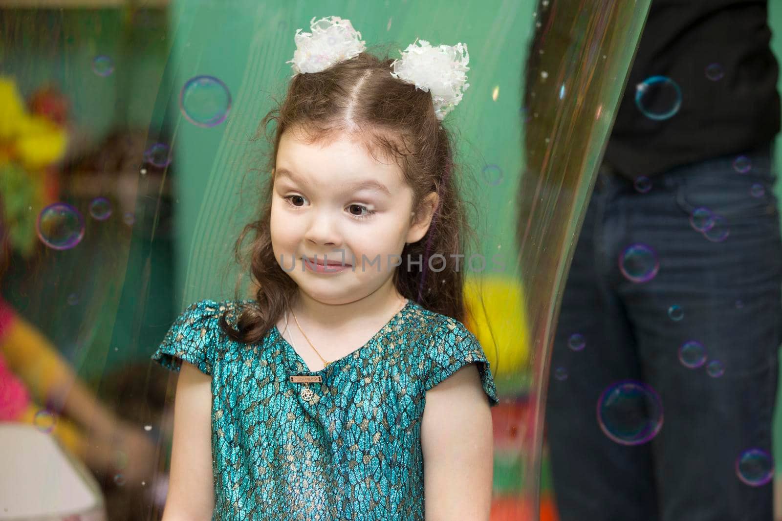 Belarus, Gomel, November 9, 2017. Gomel Children's Center.Girl inside a soap bubble at the show.