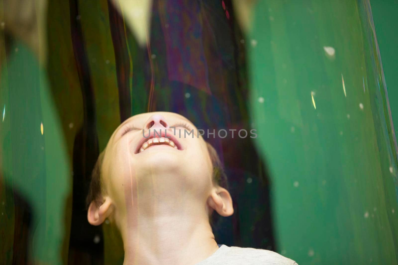 Belarus, Gomel, November 9, 2017. Gomel Children's Center.The boy inside the soap bubble on the show.