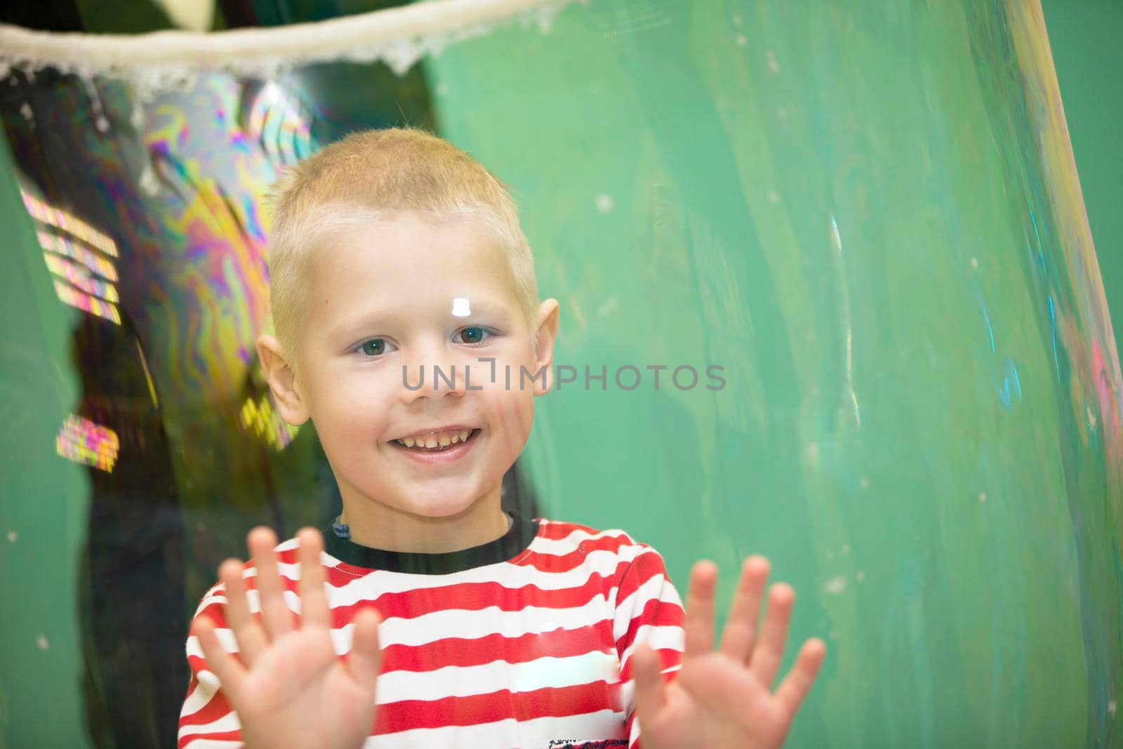 Belarus, Gomel, November 9, 2017. Gomel Children's Center.The boy inside the soap bubble on the show.