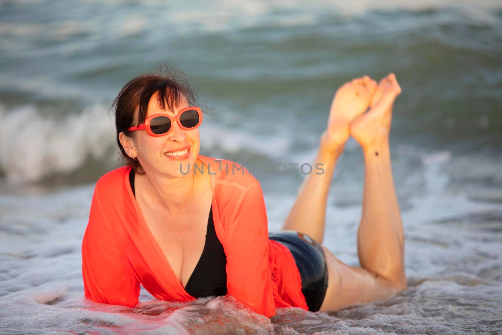 Happy woman at the sea..Portrait of a senior woman bathing in the sea