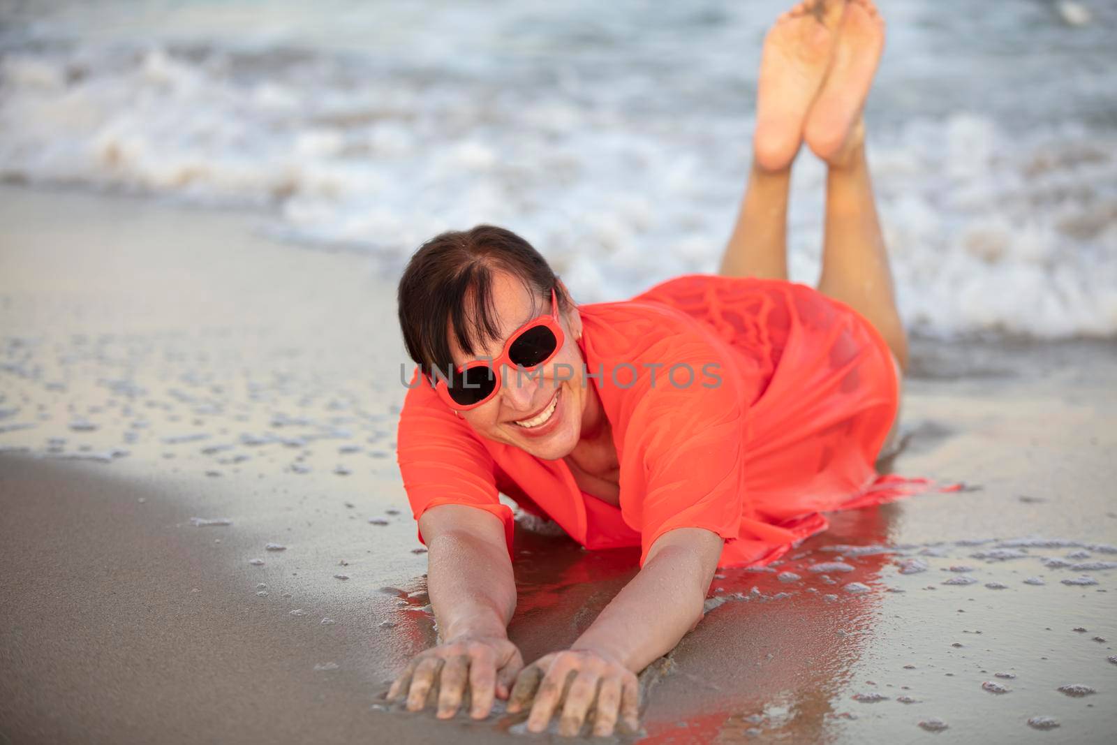 Happy woman at the sea..Portrait of a senior woman bathing in the sea