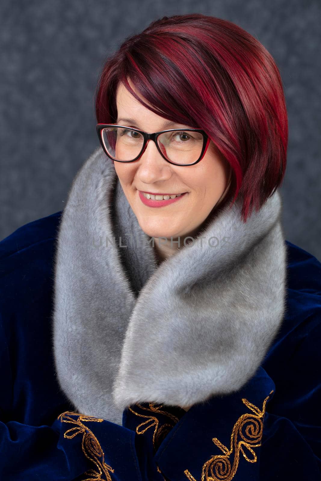 Portrait of a happy middle aged woman with glasses