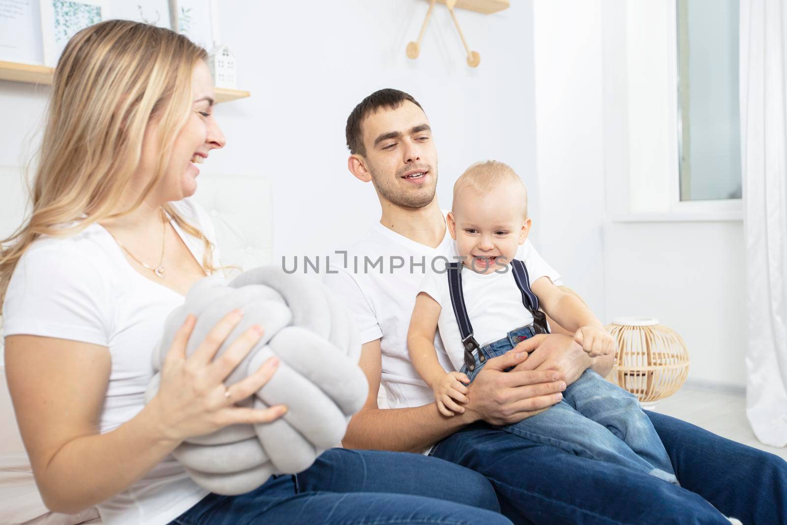 Family isolated at home. Mom dad and little child.