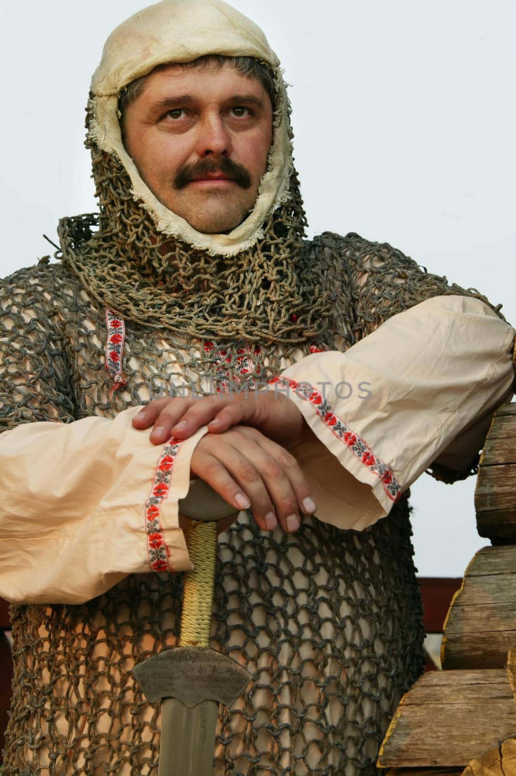 A man in the clothes of a medieval knight.