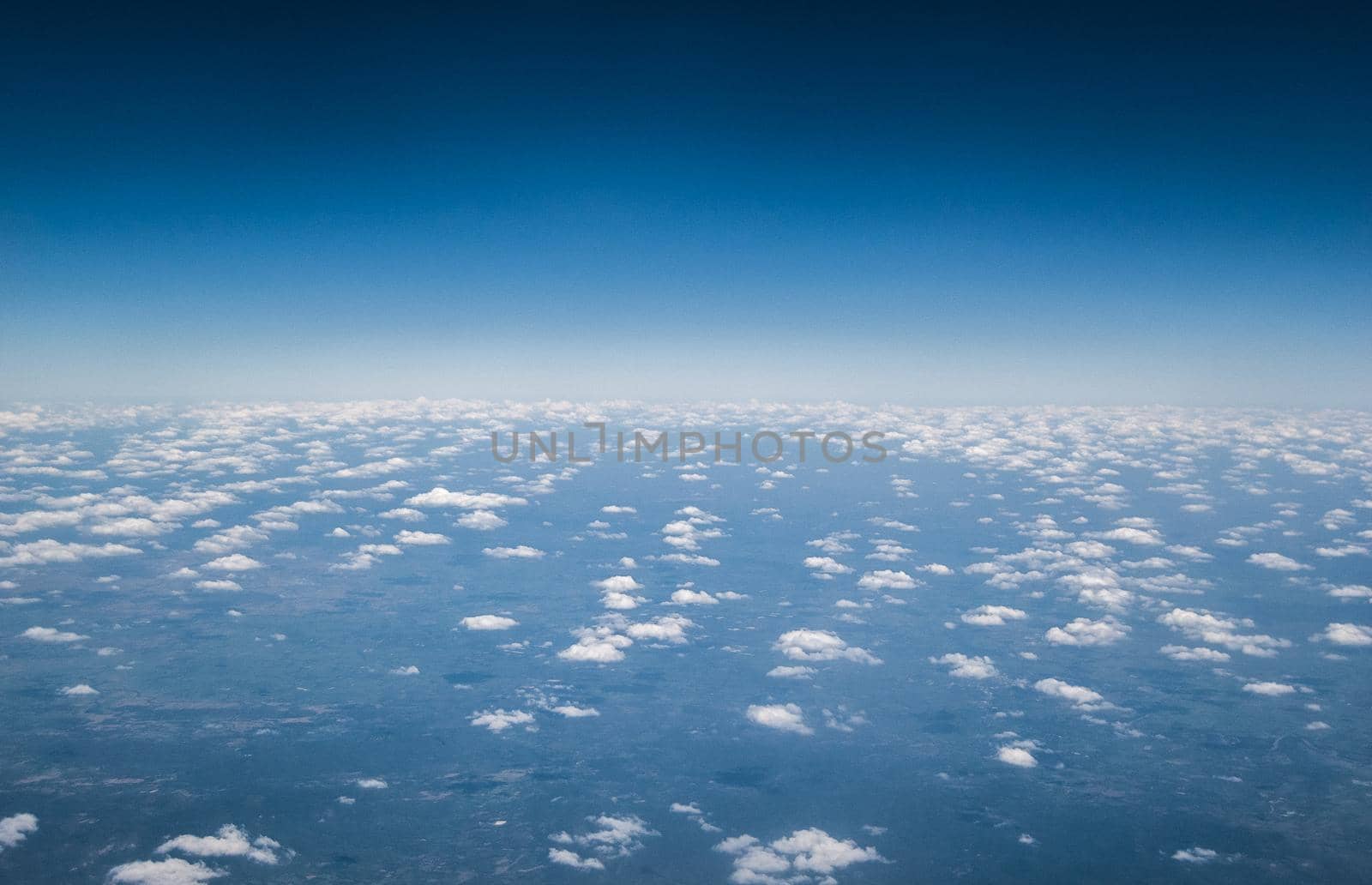 Above the clouds. White clouds. Sea of clouds. Small clouds.