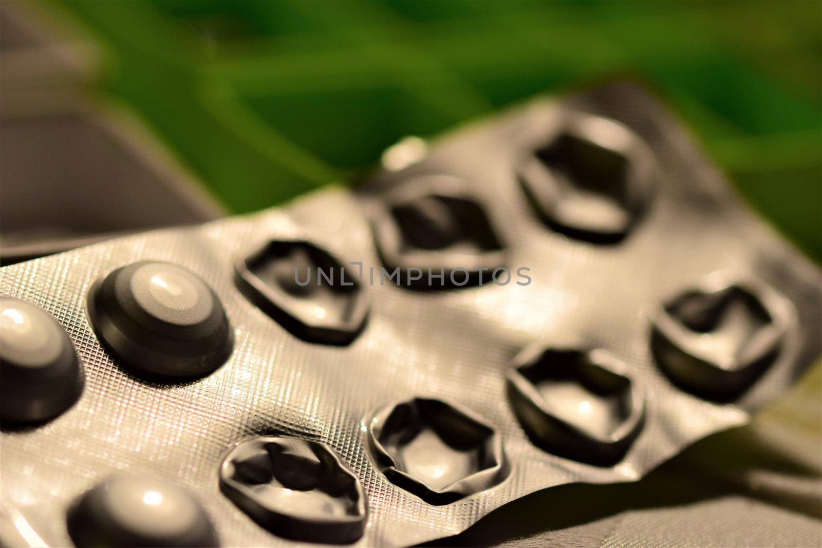 Opened tablets blister as a close up against a blurry background