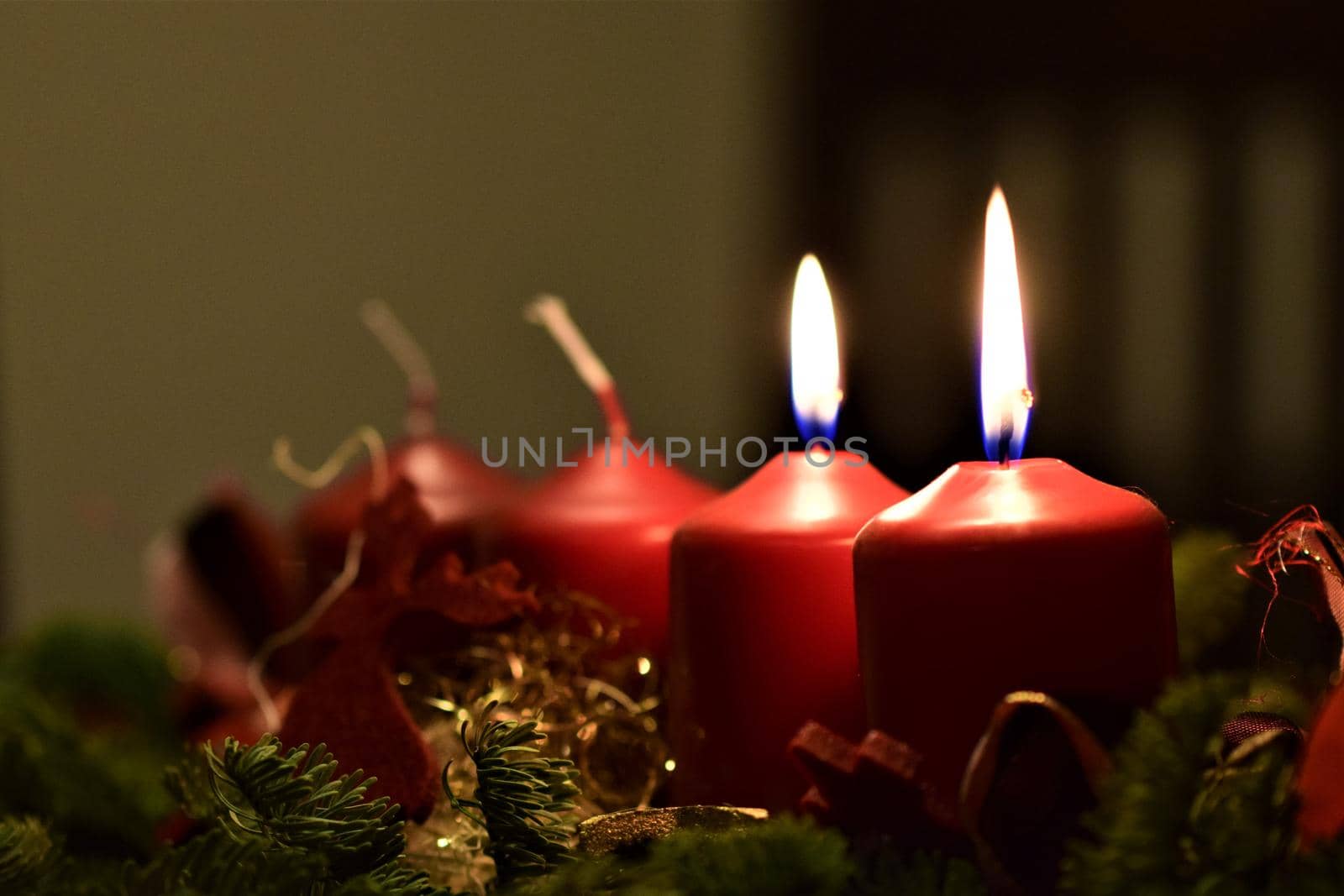 close-up of an Advent arrangement with 2 burning candles