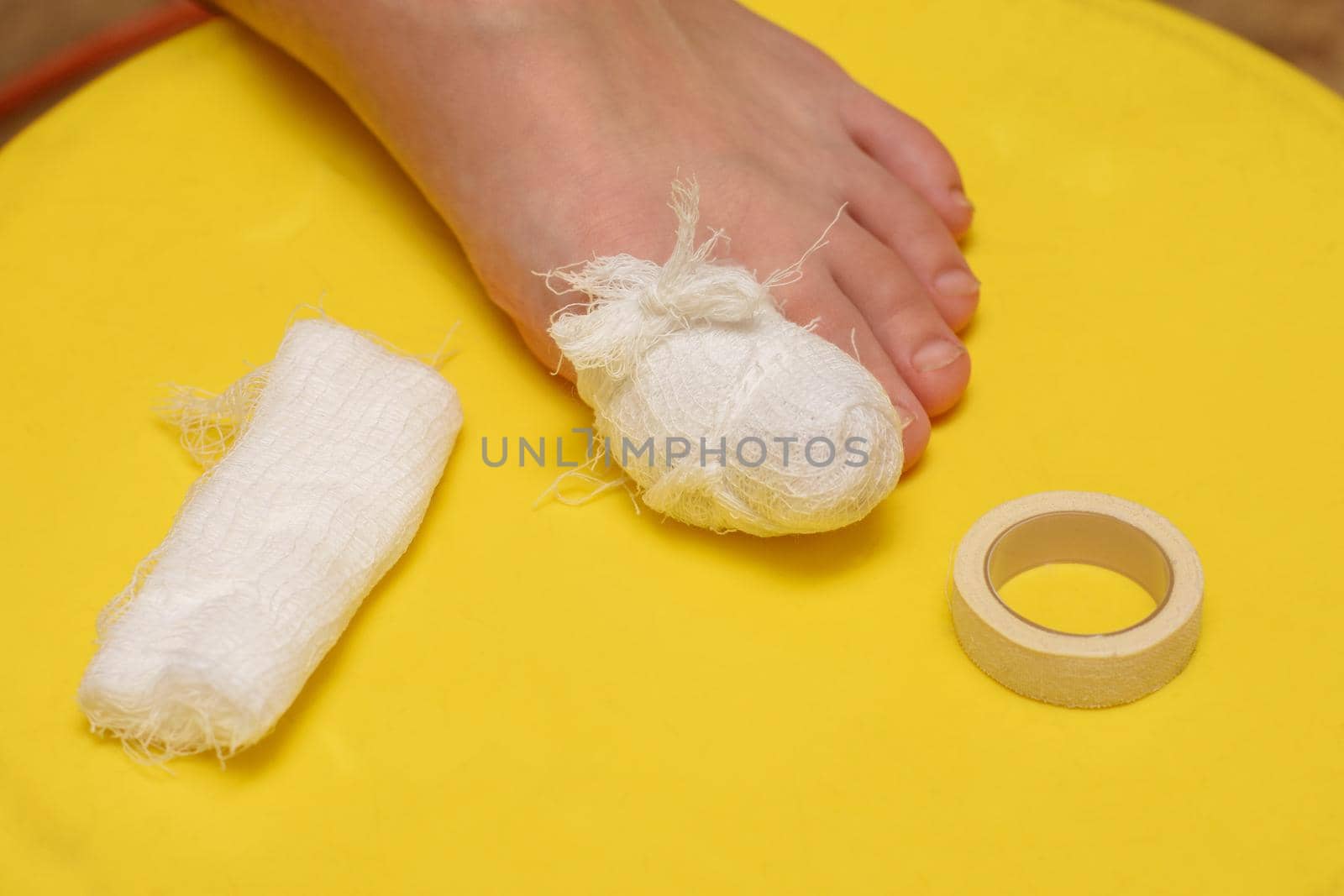 Bandage your big toe, there is a bandage and an adhesive plaster nearby
