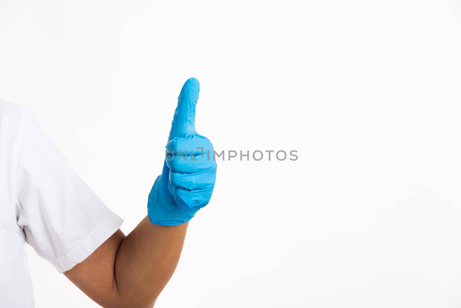 Woman wearing and putting hand to blue rubber latex glove for doctor with thumb up sign gesturing, studio shot isolated on white background, Hospital medical safety concept