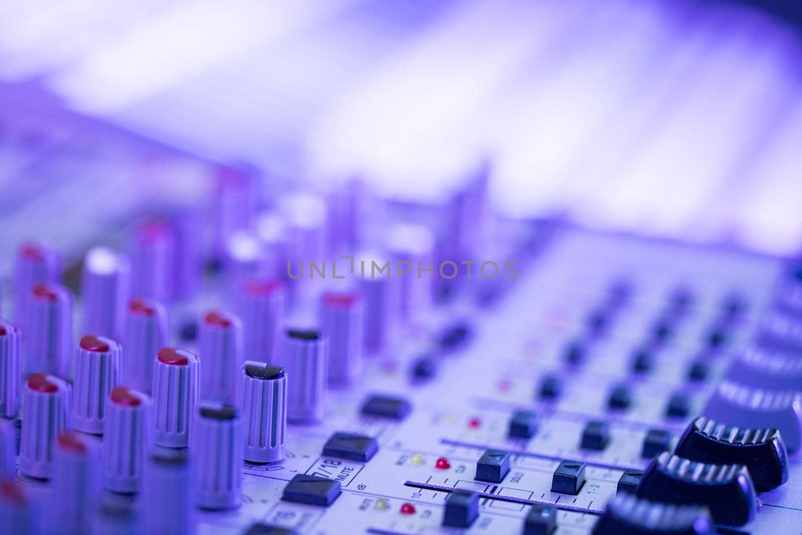 Professional music production in a sound recording studio, mixer desk