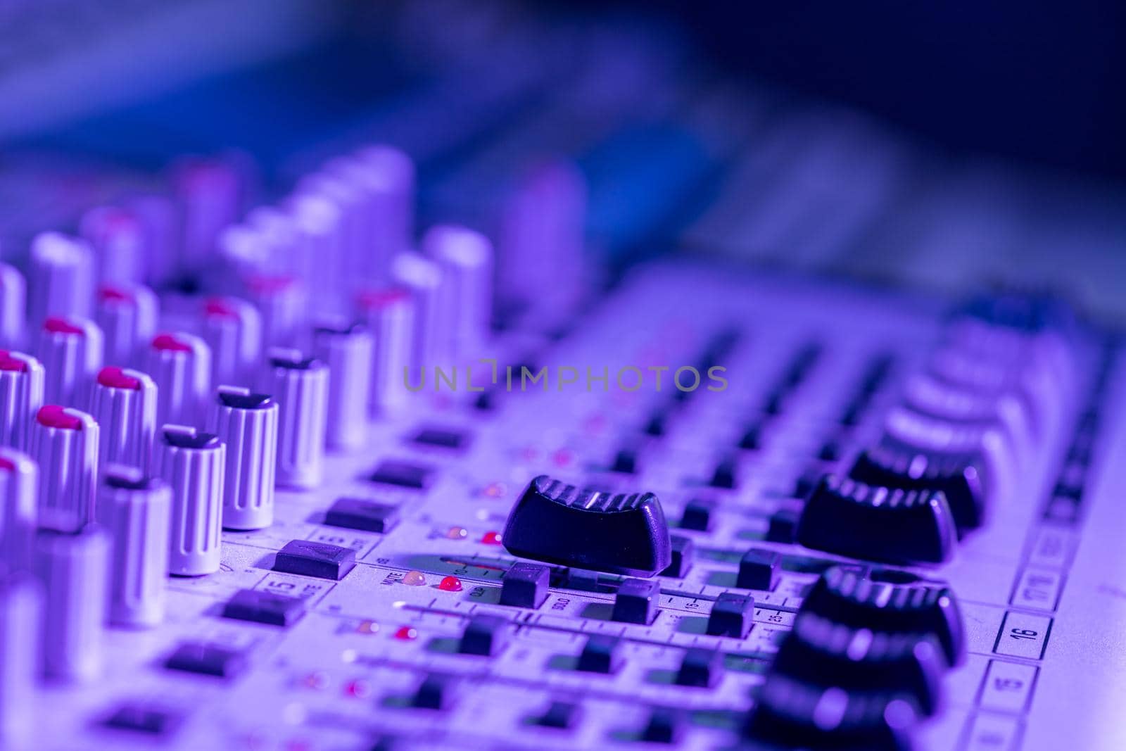 Professional music production in a sound recording studio, mixer desk