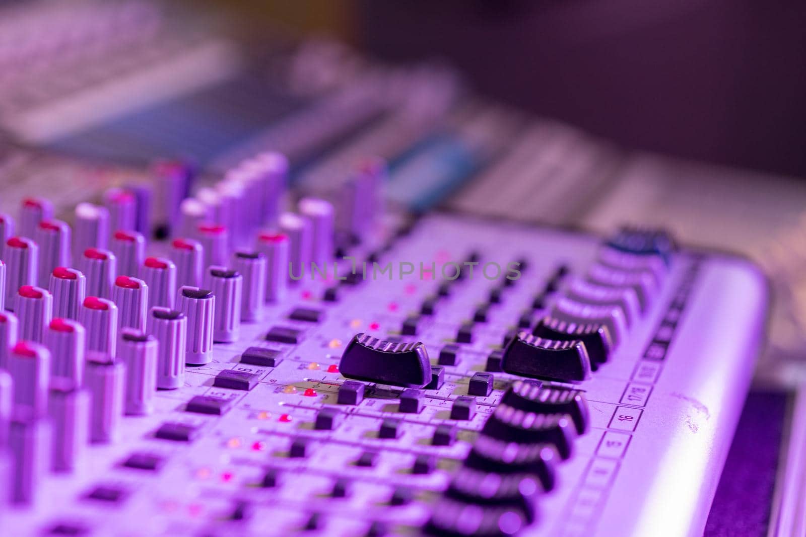 Professional music production in a sound recording studio, mixer desk