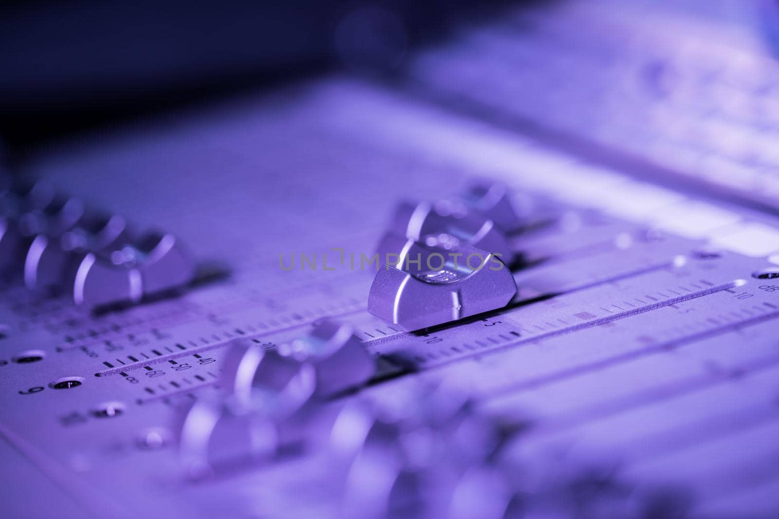 Professional music production in a sound recording studio, mixer desk