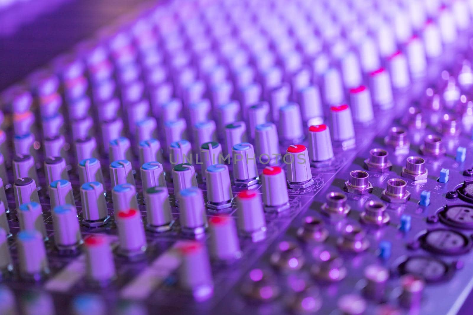 Professional music production in a sound recording studio, mixer desk