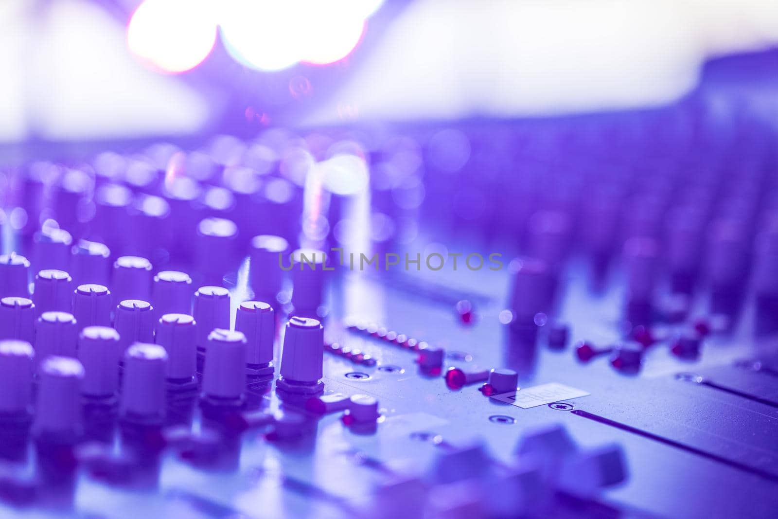 Professional music production in a sound recording studio, mixer desk