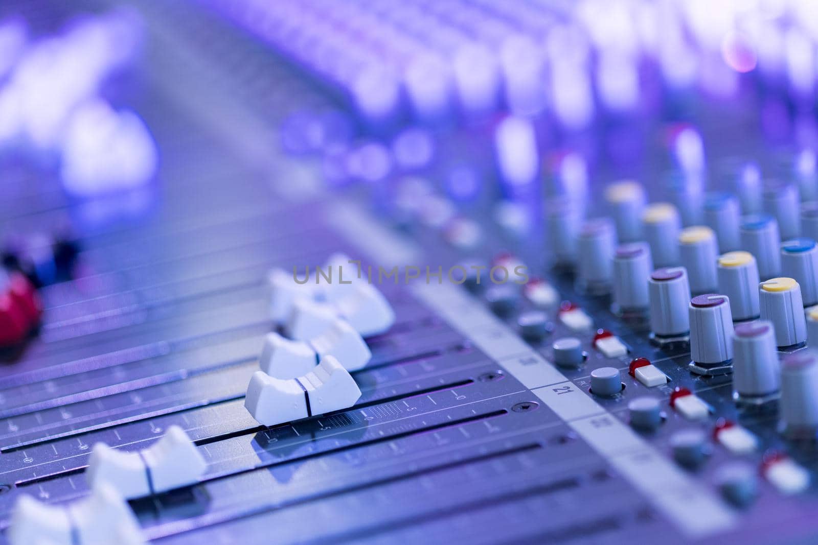 Professional music production in a sound recording studio, mixer desk