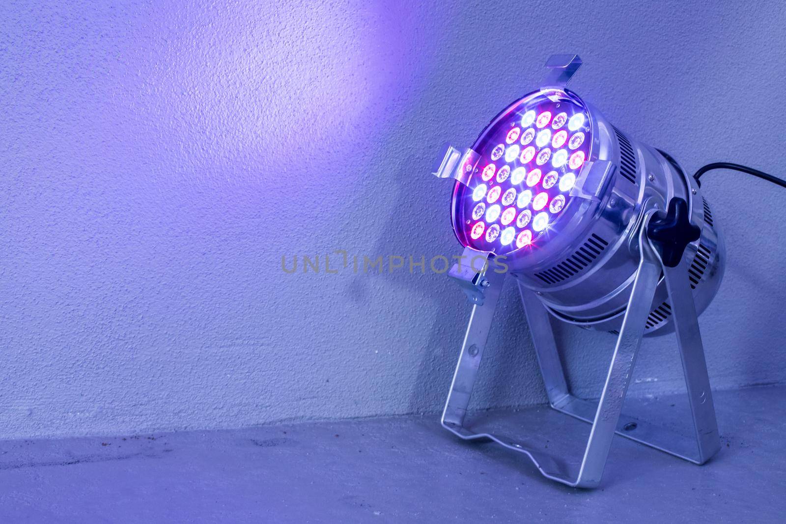 Party lighting: Colorful LED spots on the floor, hall
