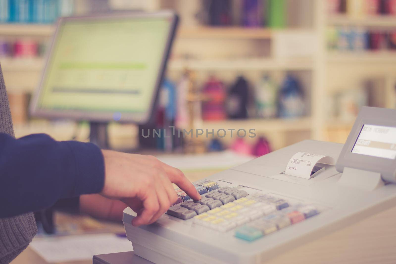 Cash register in a shop: Customer is paying purchase
