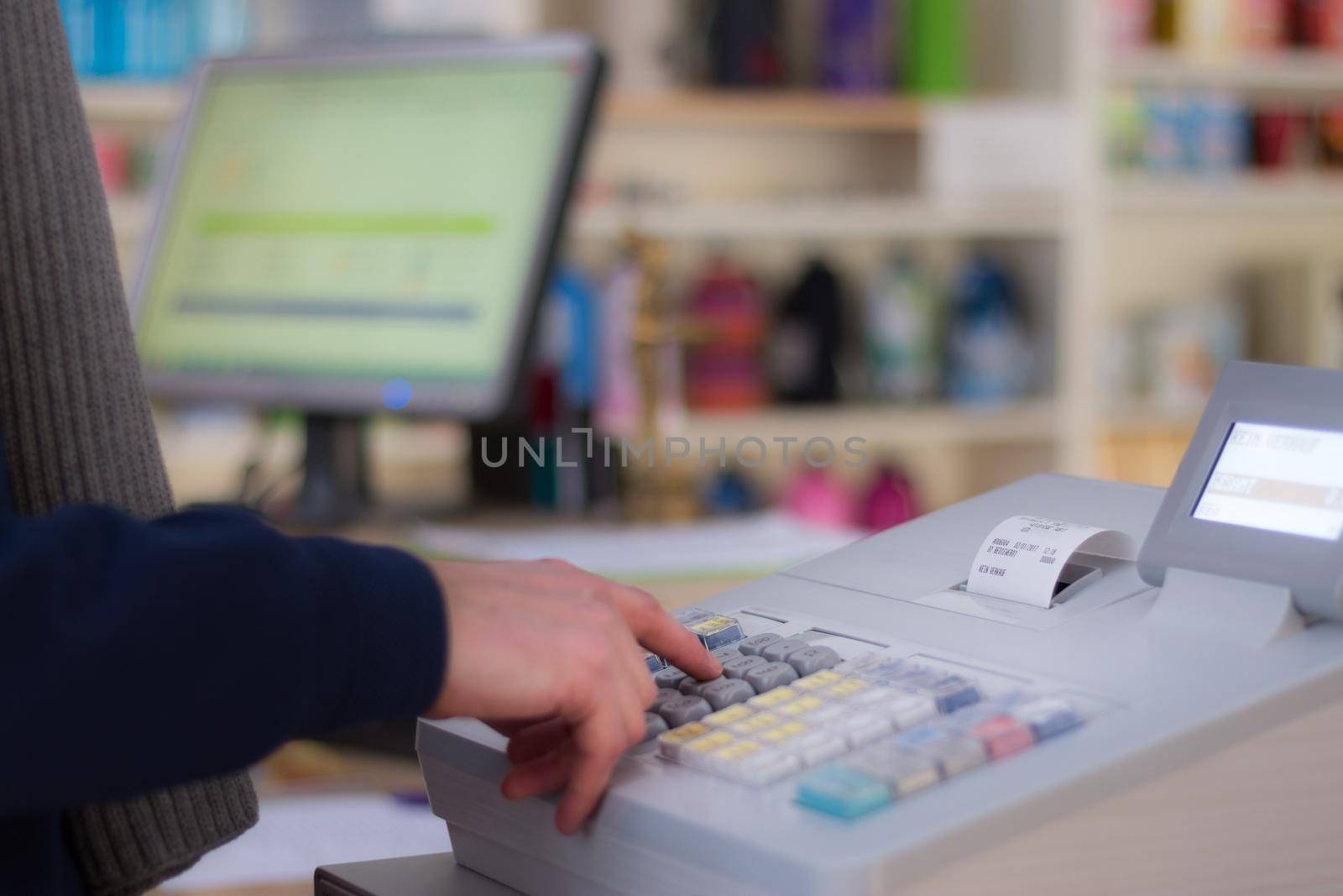 Cash register in a shop: Customer is paying purchase