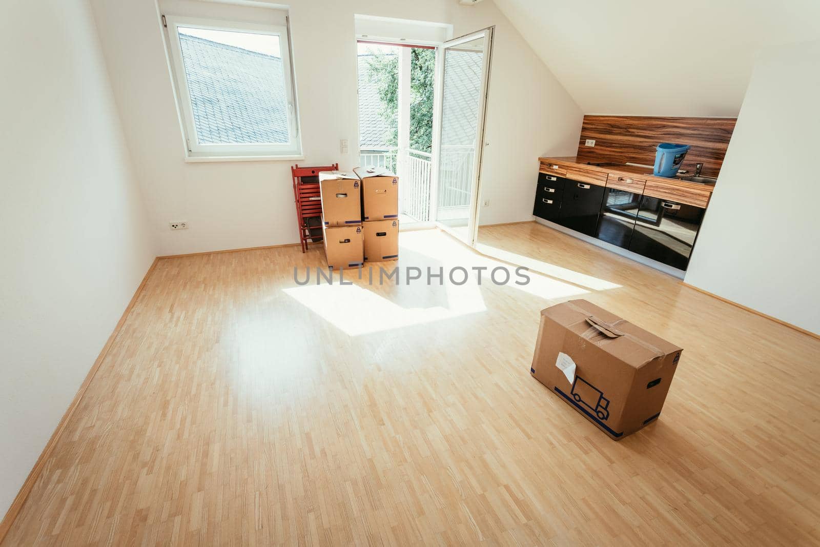Move. Cardboard, boxes for moving into a new, clean and bright home by Daxenbichler